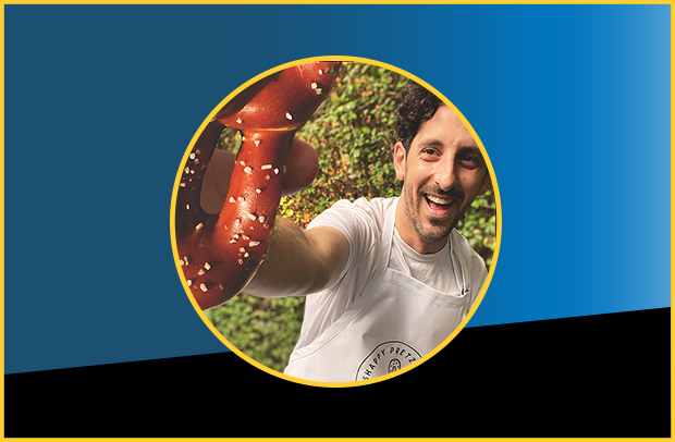 Actor, father, and 'pretzelpreneur' Adam Shapiro shows off his Philly-style pretzel of his business Shappy Pretzels.